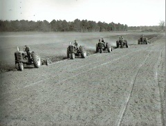 In the Spring of 1955, five tractors plower the fields at Warner Hall. The operators, from left, were John Harwood, Joe Pointer, Donald Pointer, Jimmy Pointer and M.H. Pointer Sr