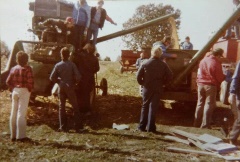 This is an old photo dated Fall 1978. This was at the Charlotte FFA Test Plot field where the current Charlotte Middle School exists today. Scott Haigh is in the driver_s seat on the John Deere 40 open station combine